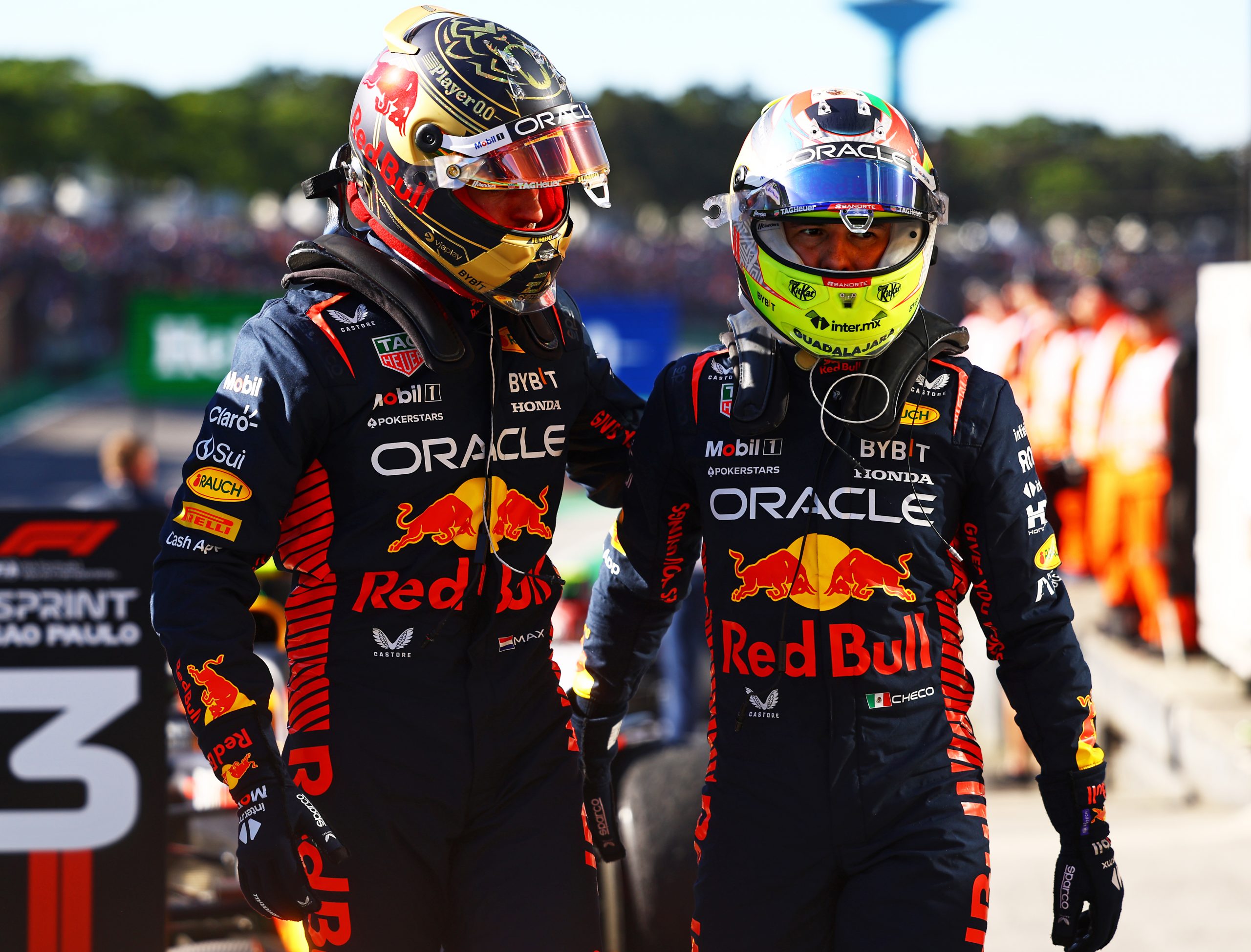 SAO PAULO, BRAZIL - NOVEMBER 04: Sprint winner Max Verstappen of the Netherlands and Oracle Red Bull Racing and Third placed Sergio Perez of Mexico and Oracle Red Bull Racing celebrate in parc ferme during the Sprint ahead of the F1 Grand Prix of Brazil at Autodromo Jose Carlos Pace on November 04, 2023 in Sao Paulo, Brazil. (Photo by Mark Thompson/Getty Images) // Getty Images / Red Bull Content Pool // SI202311040345 // Usage for editorial use only //